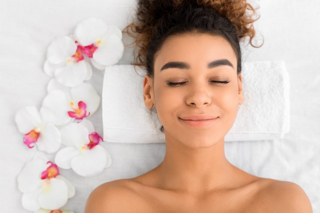 african-american-woman-getting-face-treatment-at-beauty-salon.jpg